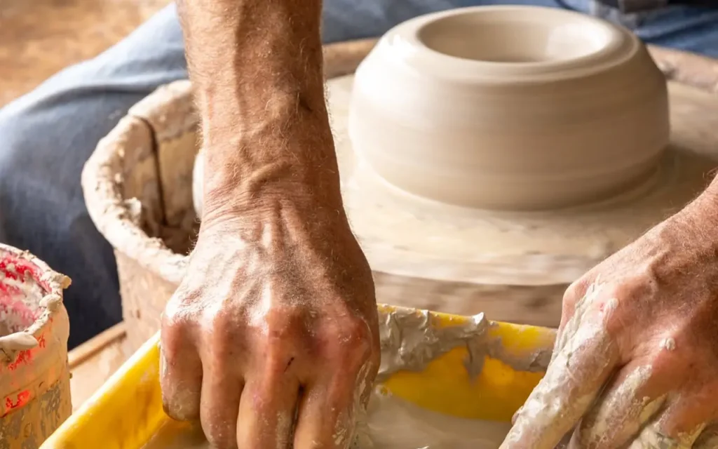 Alewine Pottery Making a Bowl On Wheel