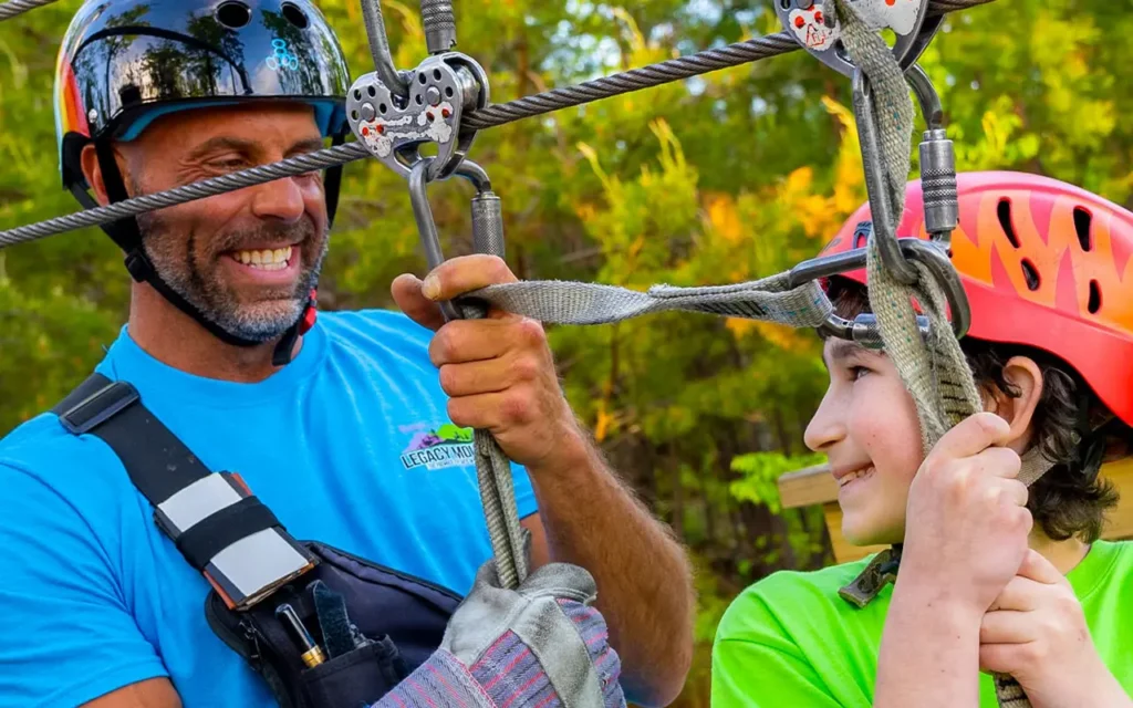 Dad and Child Riding Zipline at Legacy Mountain Ziplines