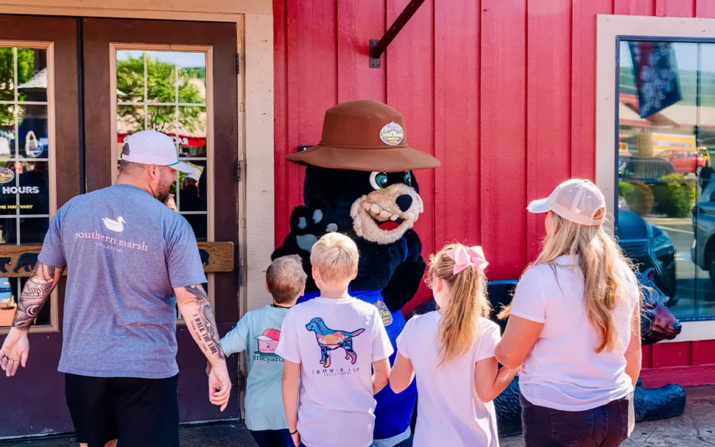 Family Walking Into Three Bears General Store