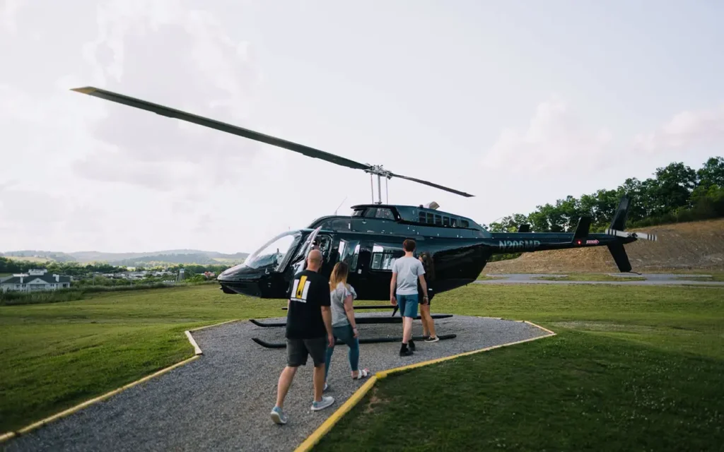 Family Walking to Helicopter to Ride at Scenic Helicopter Tours