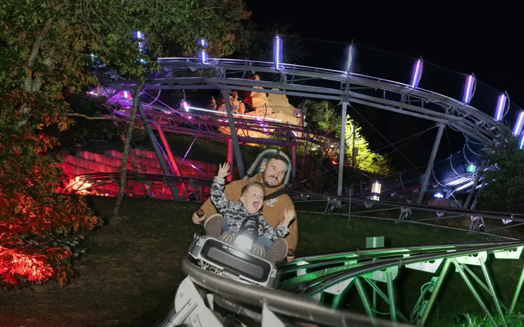 Father and Son Riding at Night at Rocky Top Mountain Coaster