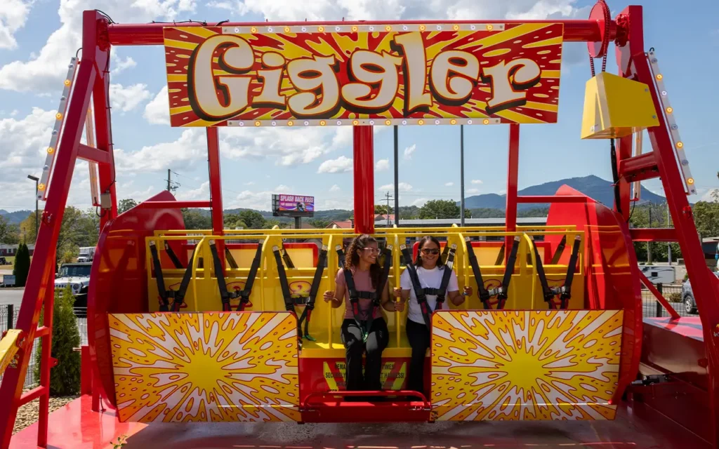 Friends Riding Carnival Ride at Rowdy Bears Smoky Mountain Funpark