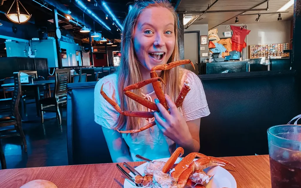 Girl Eating Crab Legs at Captain Jims Seafood
