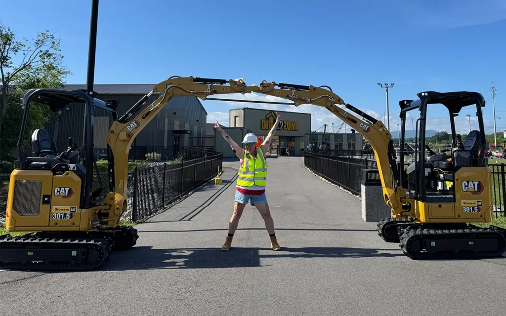Girl Under Excavator Arch at Dig N Zone Theme Park