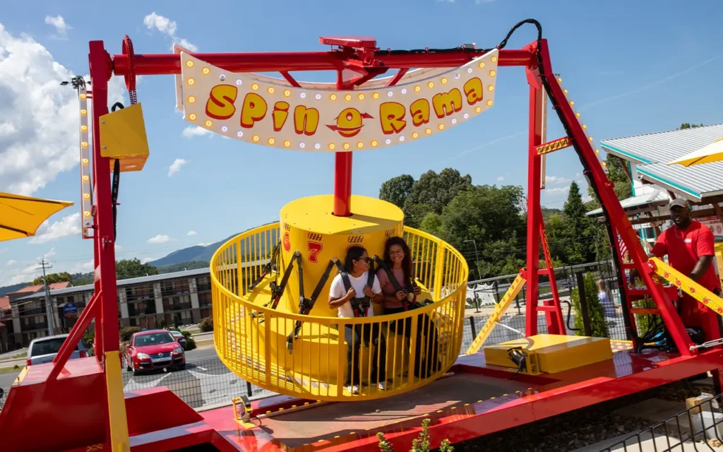 Girls Riding Carnival Ride at Rowdy Bears Smoky Mountain Funpark
