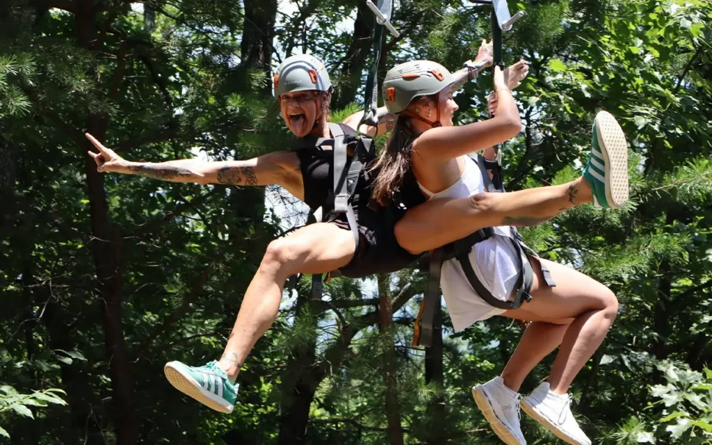 Girls Riding Zipline at Legacy Mountain Ziplines