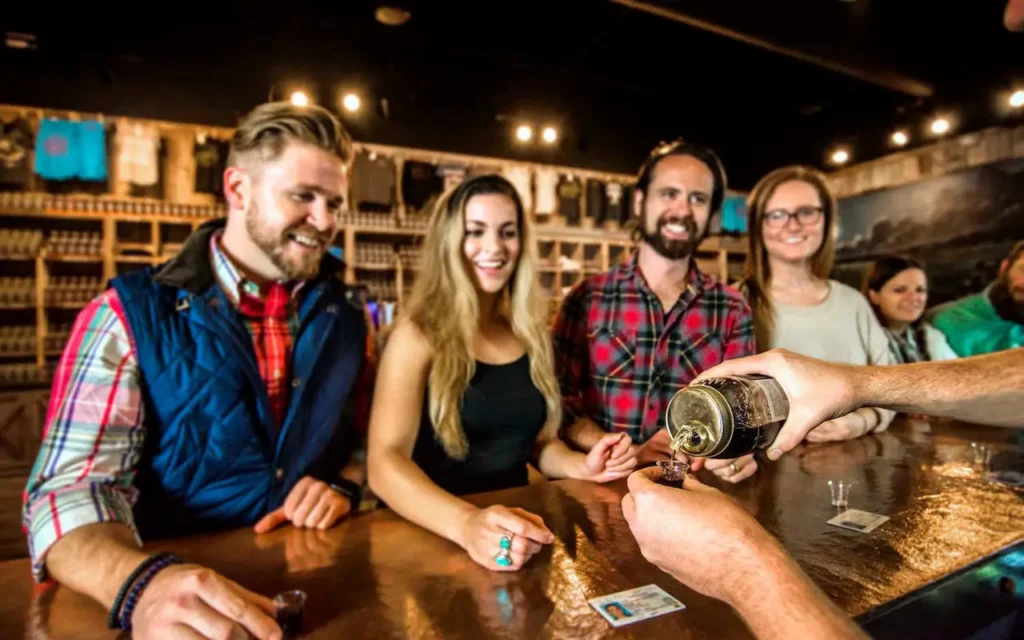 Group of People Sampling at Smith Creek Moonshine