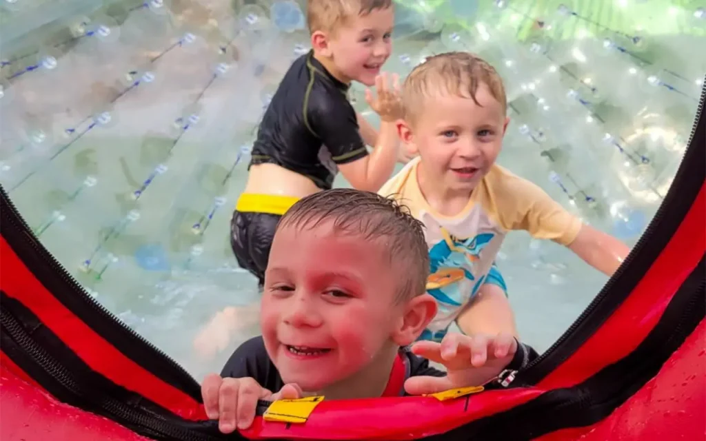 Kids Inside of Zorb Ball at Outdoor Gravity Park