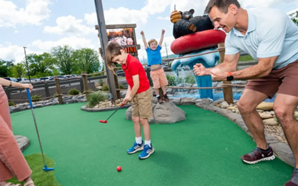 Playing Putt Putt at Lost Mine Mountain Coaster and Mini-Golf