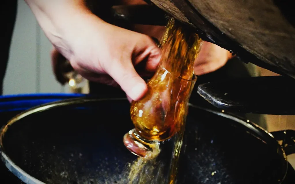 Whiskey Barrel pouring into Glass on Display At Old Tennessee Distilling Co